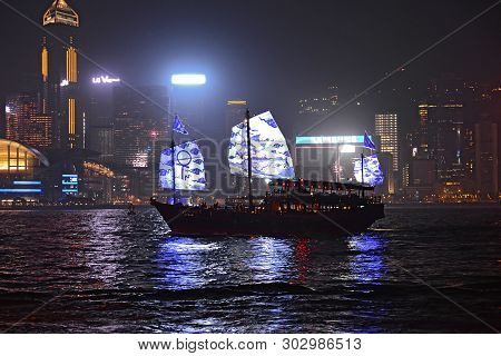 Hong Kong - February 3, 2019: Hong Kong Junk Represents Old Traditional Values Of The City. Night Cl