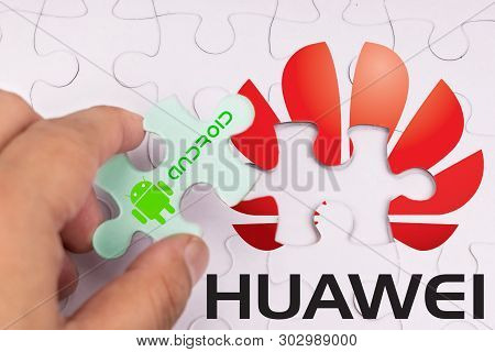 Kuala Lumpur, Malaysia, May 25, 2019: Concept Of Hand Removing Android Os From Huawei In Jigsaw Puzz