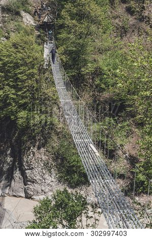 Azerbaijan, May 02, 2015: On The Way To Lahich Town
 Workers Making Suspension Bridge