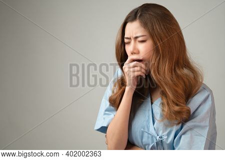 Asian Woman In Patient Gown Have Excessive Sleepiness Symptoms Or Drowsiness All The Time, Unwell Pe