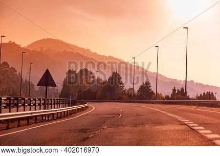 View Of Beautiful Mountain Landscape Through The Windscreen On A Sunny Day. Driving A Car On Mountai