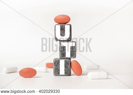 A Group Of White And Red Pills And Cubes With The Word Uti Urinary Tract Infection On Them, White Ba