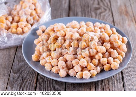 Boiled Chickpeas. Putting In A Transparent Plastic Bag For Freezing. Selective Focus. Process Of Mak
