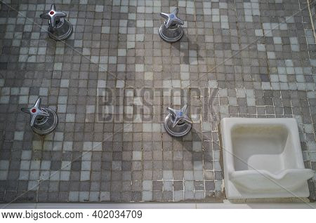 Vintage Wall Mounted Quadruple Cross Handle Faucet. Selective Focus