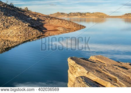 fall or winter scenery of mountain lake at foothills of Rocky Mountains in afternoon light, Horsetooth Reservoir - a popular recreational area in northern Colorado