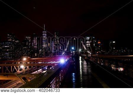Night Skyline Over New York City From The Brooklyn Bridge With Traffic. 1/8/2021