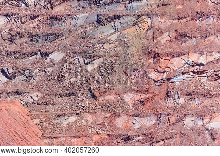 Close-up Of Red Mining Levels At Iron Ore Quarry. Open-cast Mine, Open Pit. Background, Texture