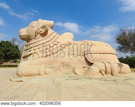 Closeup Of Beautiful Huge Or Big Lord Shiva Vehicle Nandi, Basava In A Blue Sky Background
