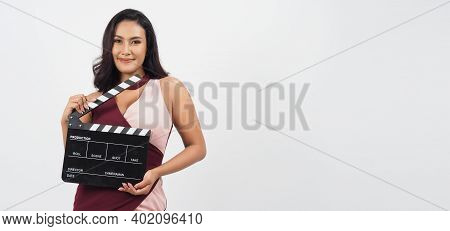 Beautiful Asian Woman With Tan Skin And Hand\'s Holding Clapper Board Or Movie Slate Use In Video Pr