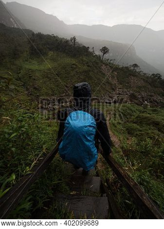 Young Hiker Descending Stairs At Catarata Del Gocta Waterfall In Bongara Amazonas Near Chachapoyas I
