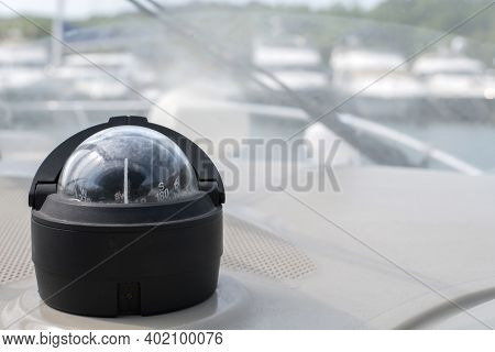 Bolshoy Utrish, Russia-07.07.2020: Yacht Compass On A Yacht Parked In The Parking Lot, With Boats In