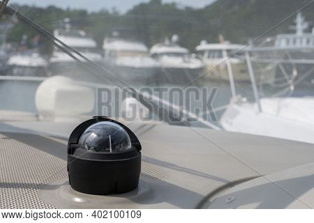 Bolshoy Utrish, Russia-07.07.2020: Yacht Compass On A Yacht Parked In The Parking Lot, With Boats In