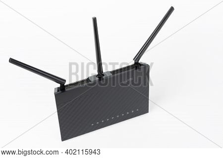 Dual-band Gigabit Wi-fi Router With  Three Antennas. Wireless Device On White Background.