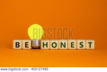 Be Honest Symbol. Wooden Cubes With Words 'be Honest'. Yellow Light Bulb. Beautiful Orange Backgroun