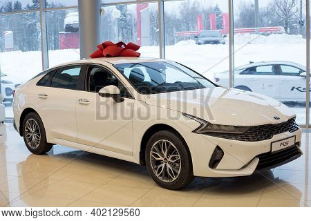 Russia, Izhevsk - December 28, 2020: New Modern K5 In The Kia Showroom. Front And Side View.