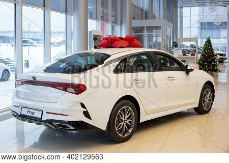 Russia, Izhevsk - December 28, 2020: Kia Showroom. New K5 Business Class Car In Dealer Showroom. Bac