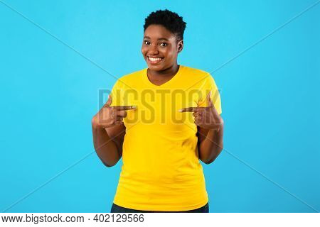 Choose Me. Cheerful Oversized African Lady Pointing Fingers At Herself Smiling To Camera Standing Po
