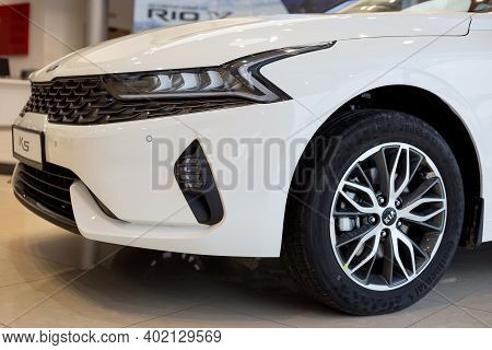 Russia, Izhevsk - December 28, 2020: Kia Showroom. New K5 Business Class Car In Dealer Showroom. Cro