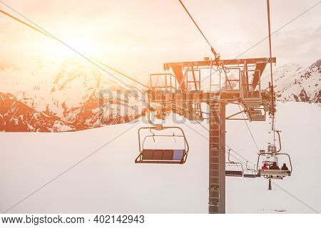 Ski Chair Lift Ropeway At The Ski Resort, View From The Funicular To The Mountains
