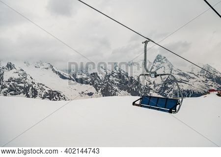 Ski Chair Lift Ropeway At The Ski Resort, View From The Funicular To The Mountains