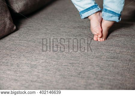 Baby's First Steps. The Baby's Feet Take The First Steps. Photo Of Children's Legs Barefoot.