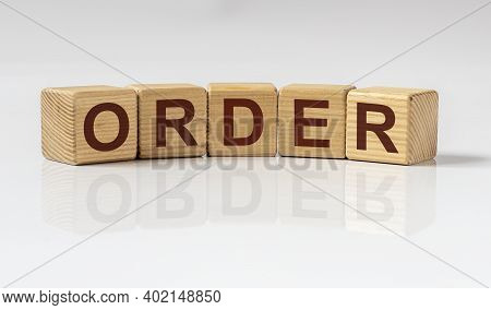 Order Word Inscription On Wooden Cubes. Business And Law Concept