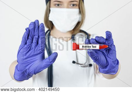 Medicine And Health Concept. The Doctor Holds In His Hands A Test Tube With Blood Tests For The Acet