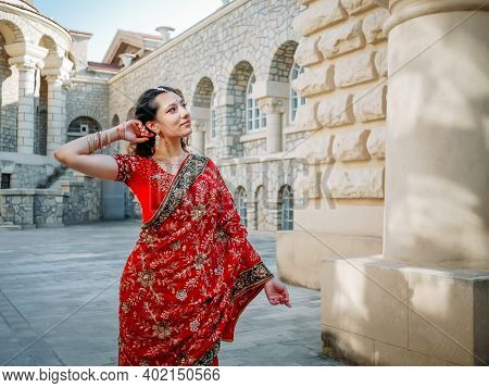 Beautiful Ethnic Indian Saree. Young Woman In Red, Colorful, Sensual, Wedding And Very Feminine Outf