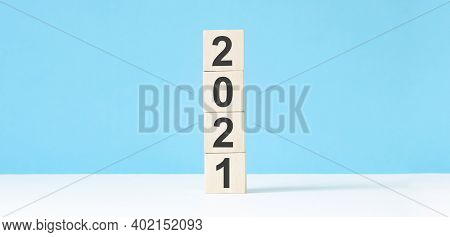 2021 New Year Wooden Cubes On Blue Table Background With Copy Space For Text. Business Goals, Missio