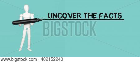 White Mannequin Man Holds Marker. Text Uncover The Facts