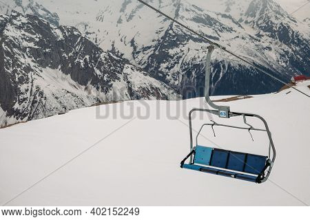 Ski Chair Lift Ropeway At The Ski Resort, View From The Funicular To The Mountains