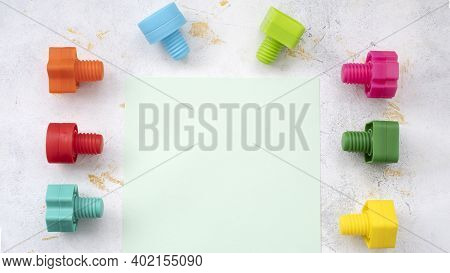 Educational Constructor For Children, Nuts And Bolts In The Form Of Geometric Shapes. Mock Up Backgr