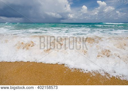Seascape, Small Waves With White Foam At The Top Against The Background Of Blue Water. Low, Dense Cl