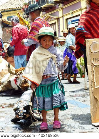 Cuenca, Ecuador - February 22, 2020: Carnival Parade In Cuenca City. Indigenous Village Girl With Ar