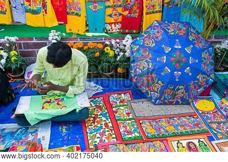 Kolkata, West Bengal, India - 31st December 2018 : Young Bengali Artist Painting Pattachitra Or Pata