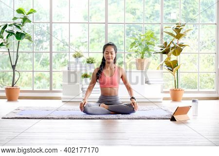 Asian Woman Practice Yoga Meditation Exercise At Home By Online Training Class, Young Asia Female Si