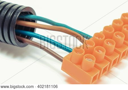 Plastic Orange Electrical Cube With Connections Of Electric Copper Wires. Components And Accessories