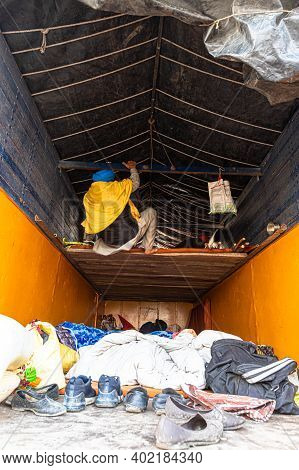 New Delhi, India - December 2020:
A Farmer Trying To Sit Inn Its Truck During The Protest. They Are 