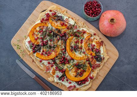 Tarte Flambee With Pumpkin, Cheese, Kale And Pomegranate