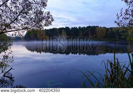 Early Morning On The Lake. Fog Over The Lake. Forest Lake In Calm Weather.