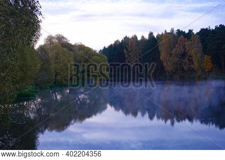 Early Morning On The Lake. Fog Over The Lake. Forest Lake In Calm Weather.