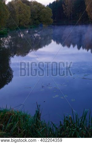 Early Morning On The Lake. Fog Over The Lake. Forest Lake In Calm Weather.