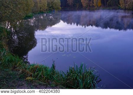 Early Morning On The Lake. Fog Over The Lake. Forest Lake In Calm Weather.