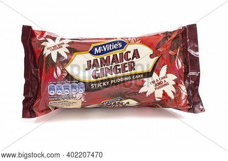 Swindon, Uk - January 2, 2021:  Packet Of Mcvities Jamaica Ginger Sticky Pudding Cake On A White Bac