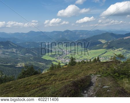 View On Village Liptovska Luzna From Ridge Of Low Tatras Mountains With Mountains, Hills, Meadow And