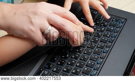 Top View Of Mother Showing Her Child How To Use Computer Keyoard. Boy With Parent Learnign And Study