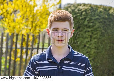 Young Red Haired Boy Looking Confident And Happy