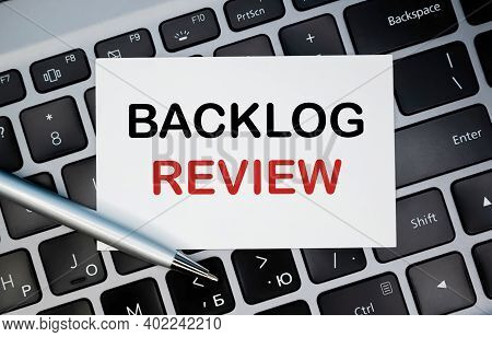 Business Card On The Keyboard With 'backlog Review' Word, Closeup Shot