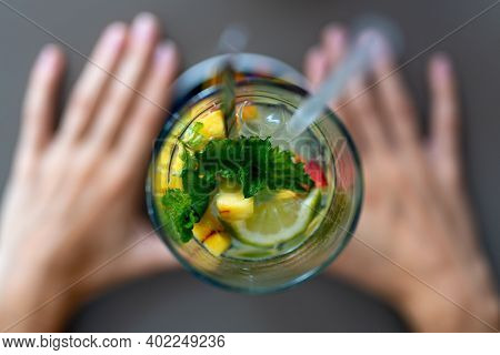 Photo From Restarurant With Colorful Drink With Hands Taken Tabletop
