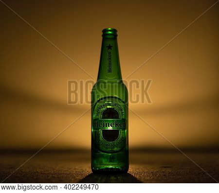 Photo Of Green Empty Heineken Bottle With Lights And Shadows